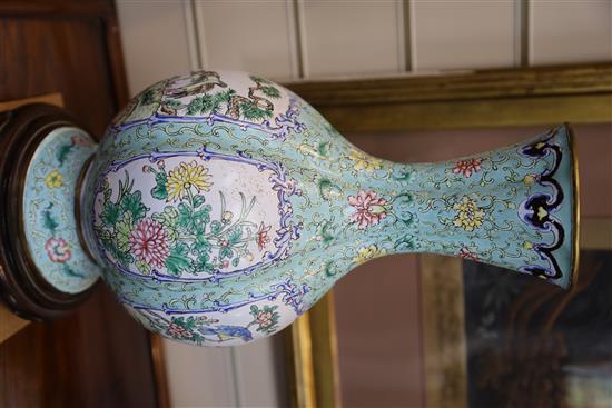 A pair of Chinese Canton enamel vases, early 20th century, H. 35cm, wood stands